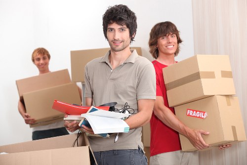 Removal team packing furniture and boxes for a local move