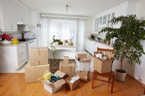 Packed boxes and furniture ready for a local removal van move