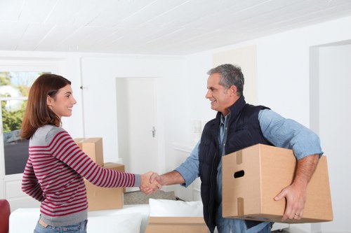 Packed office furniture and boxes ready for a business move in Rotherhithe